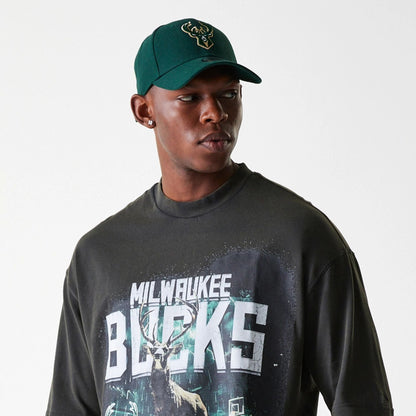 The Male model is wearing Milwaukee Bucks NBA Washed Graphic Grey T-Shirt 5