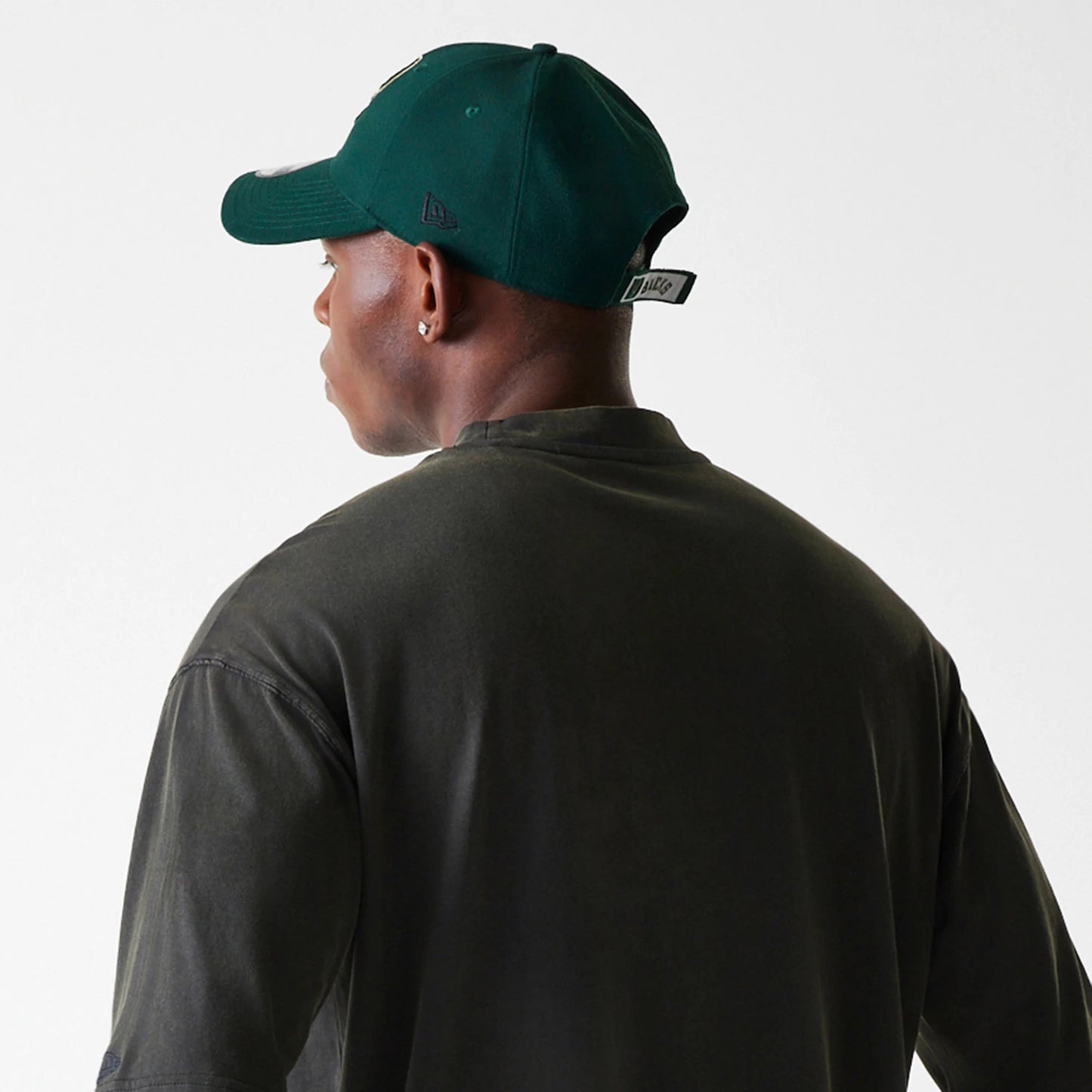 The Male model is wearing Milwaukee Bucks NBA Washed Graphic Grey T-Shirt 8