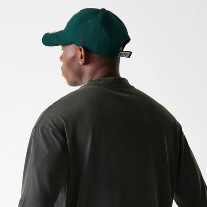 The Male model is wearing Milwaukee Bucks NBA Washed Graphic Grey T-Shirt 8