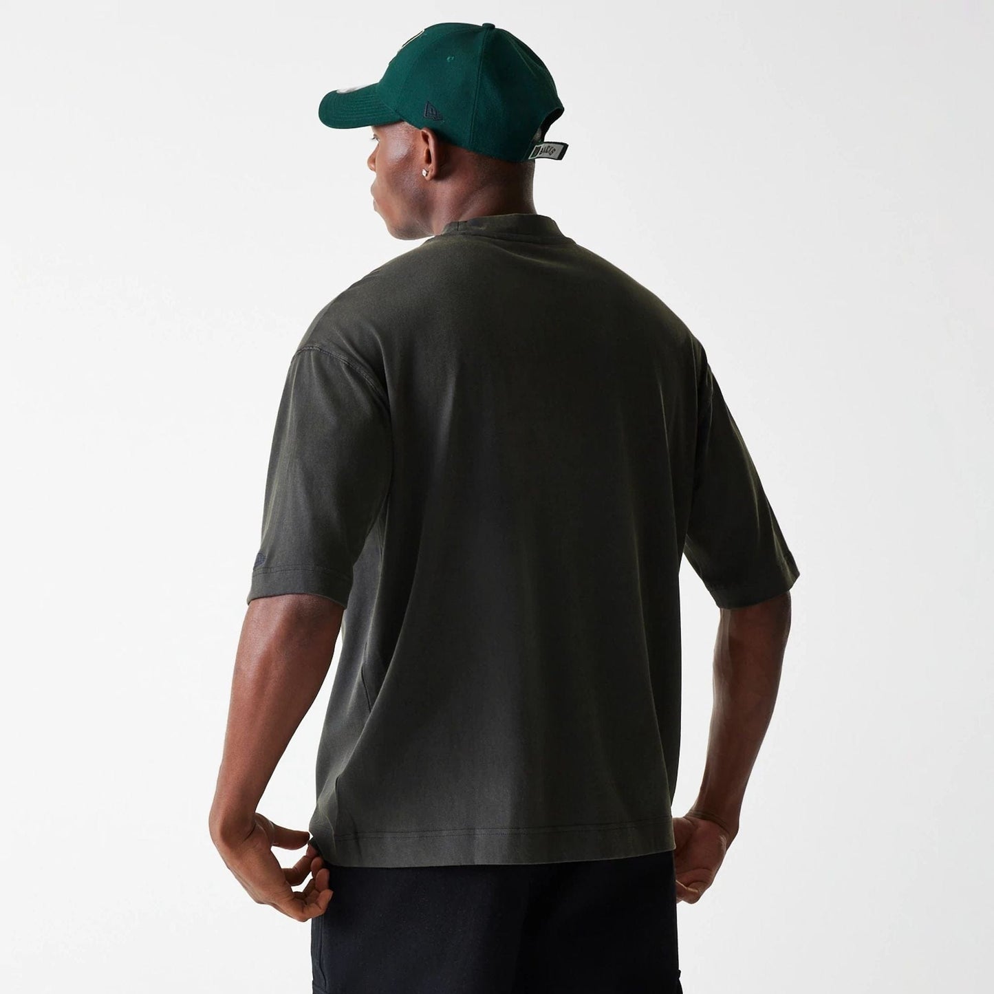 The Male model is wearing Milwaukee Bucks NBA Washed Graphic Grey T-Shirt 2