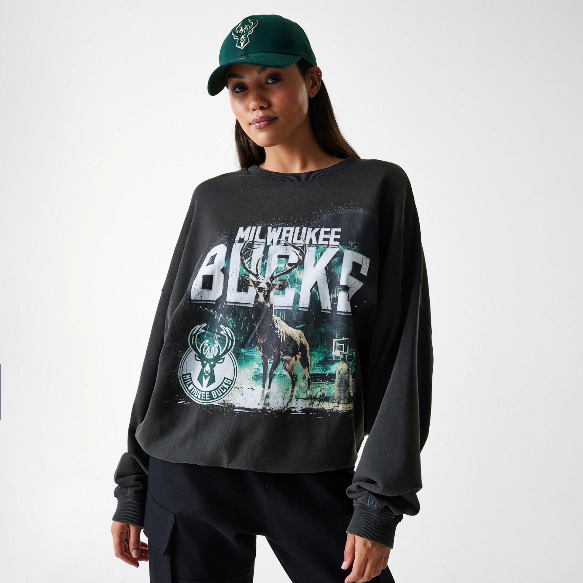 The Male model is wearing Milwaukee Bucks NBA Washed Graphic Grey Oversized Crew Neck Sweater 4