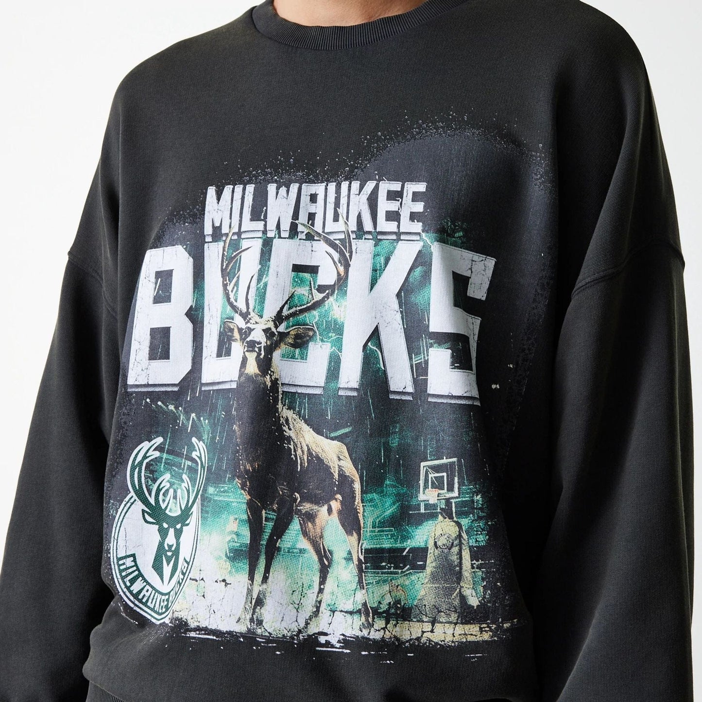 The Male model is wearing Milwaukee Bucks NBA Washed Graphic Grey Oversized Crew Neck Sweater 6