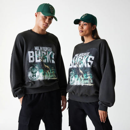 The Male model is wearing Milwaukee Bucks NBA Washed Graphic Grey Oversized Crew Neck Sweater 1