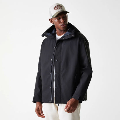 The Male model is wearing New Era Black Coach Jacket 5