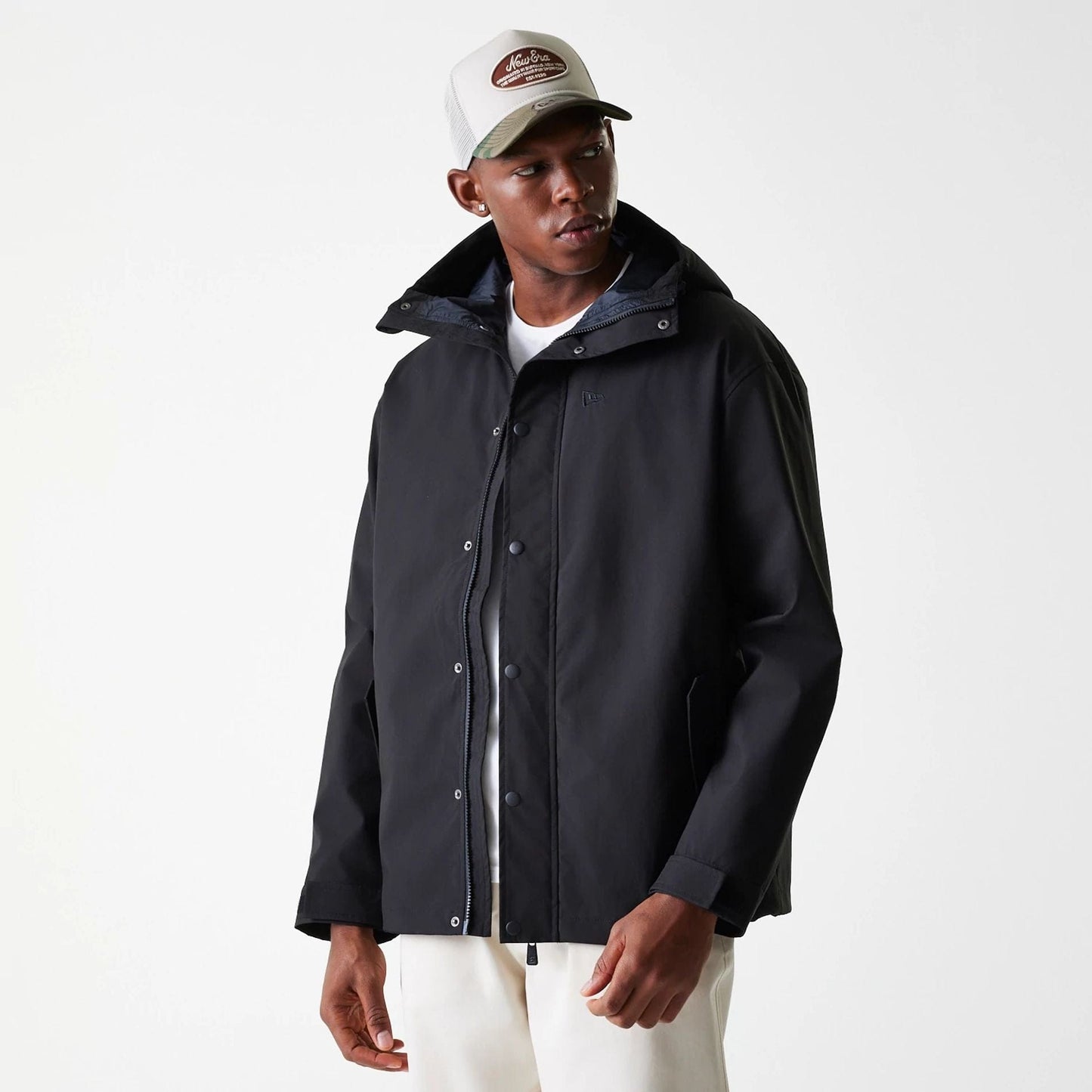 The Male model is wearing New Era Black Coach Jacket 5