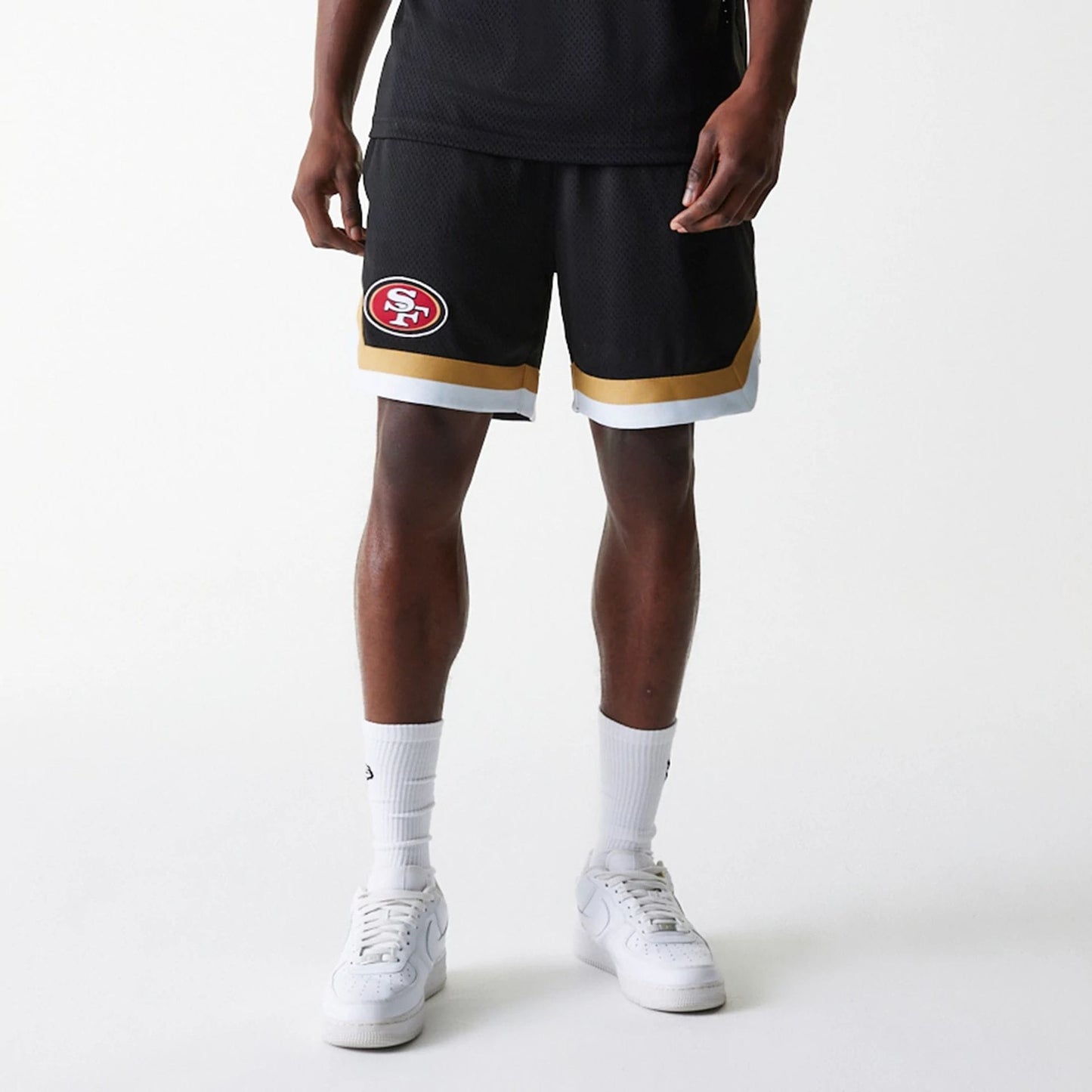 The Male model is wearing San Francisco 49ers NFL Mesh Black Shorts 7