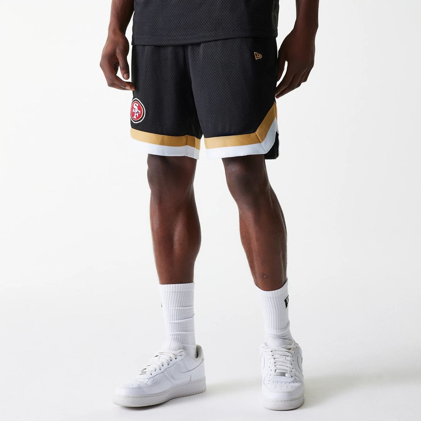 The Male model is wearing San Francisco 49ers NFL Mesh Black Shorts 1