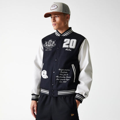 The Male model is wearing New Era Patch Black Varsity Jacket 3