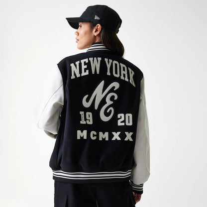 The Male model is wearing New Era Patch Black Varsity Jacket 2