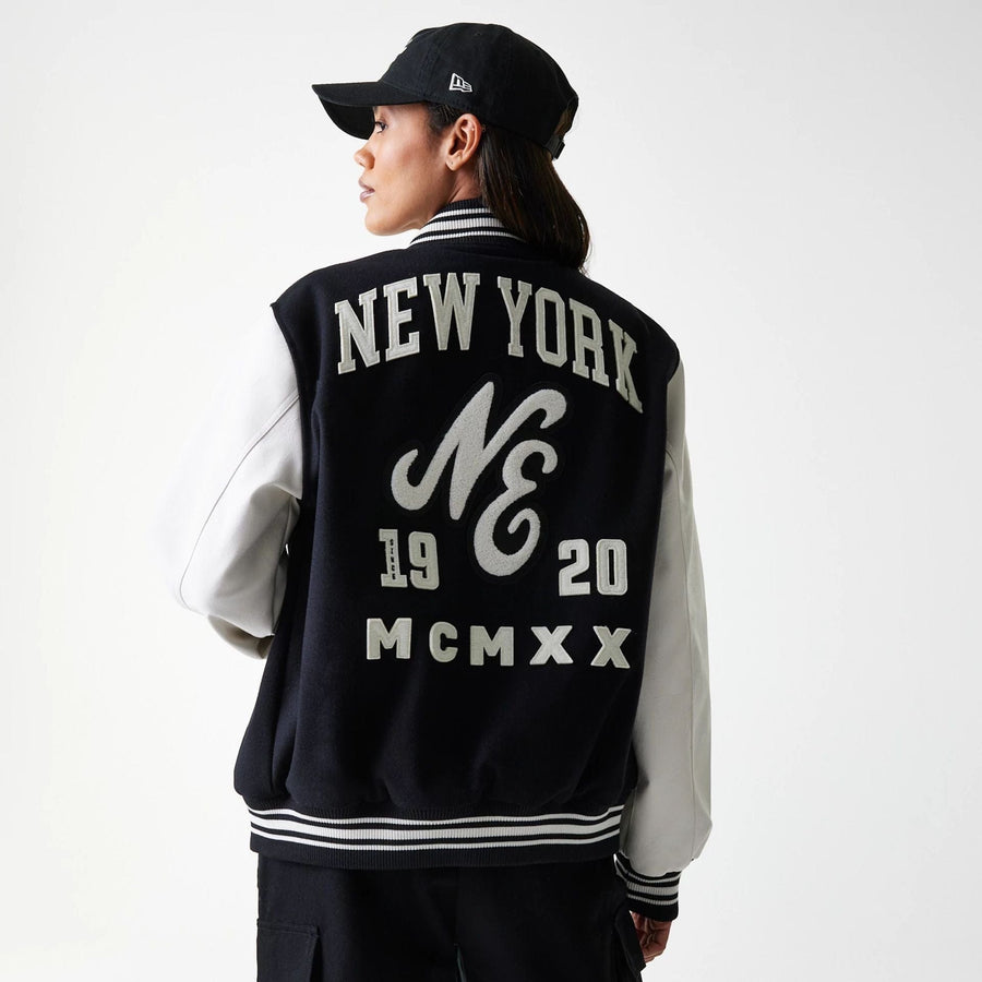 The Male model is wearing New Era Patch Black Varsity Jacket 2