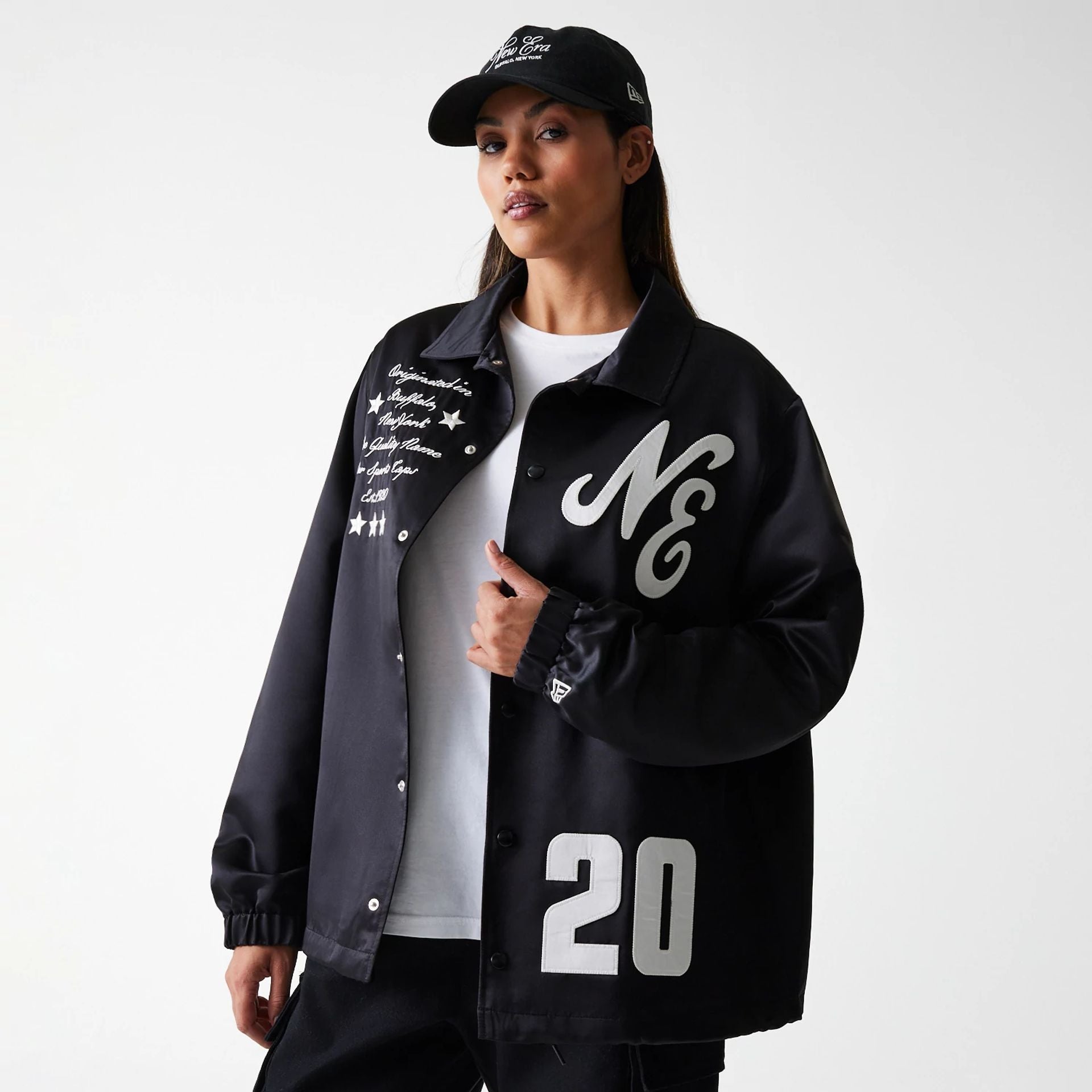 The Male model is wearing New Era Black Coaches Jacket 4