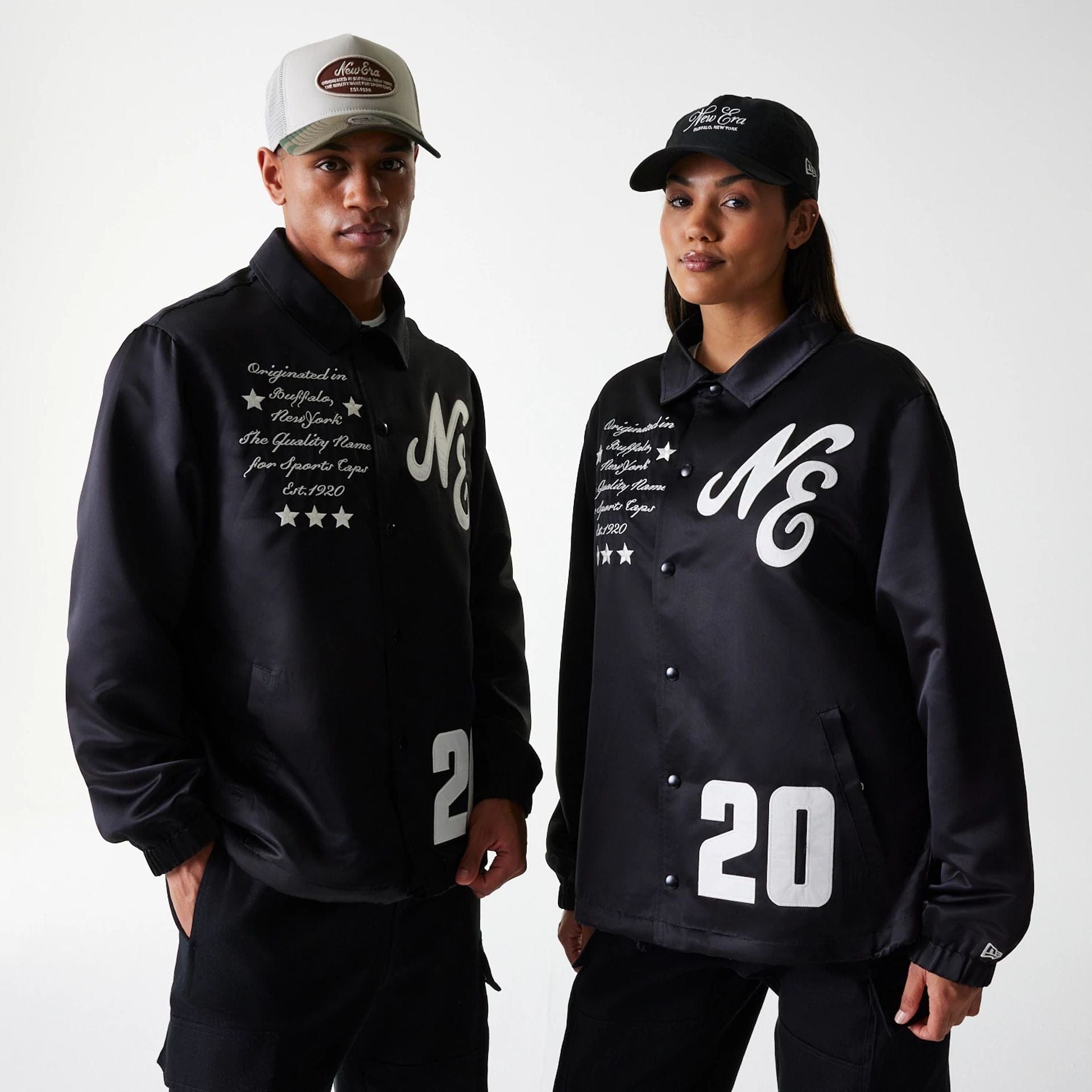 The Male model is wearing New Era Black Coaches Jacket 1