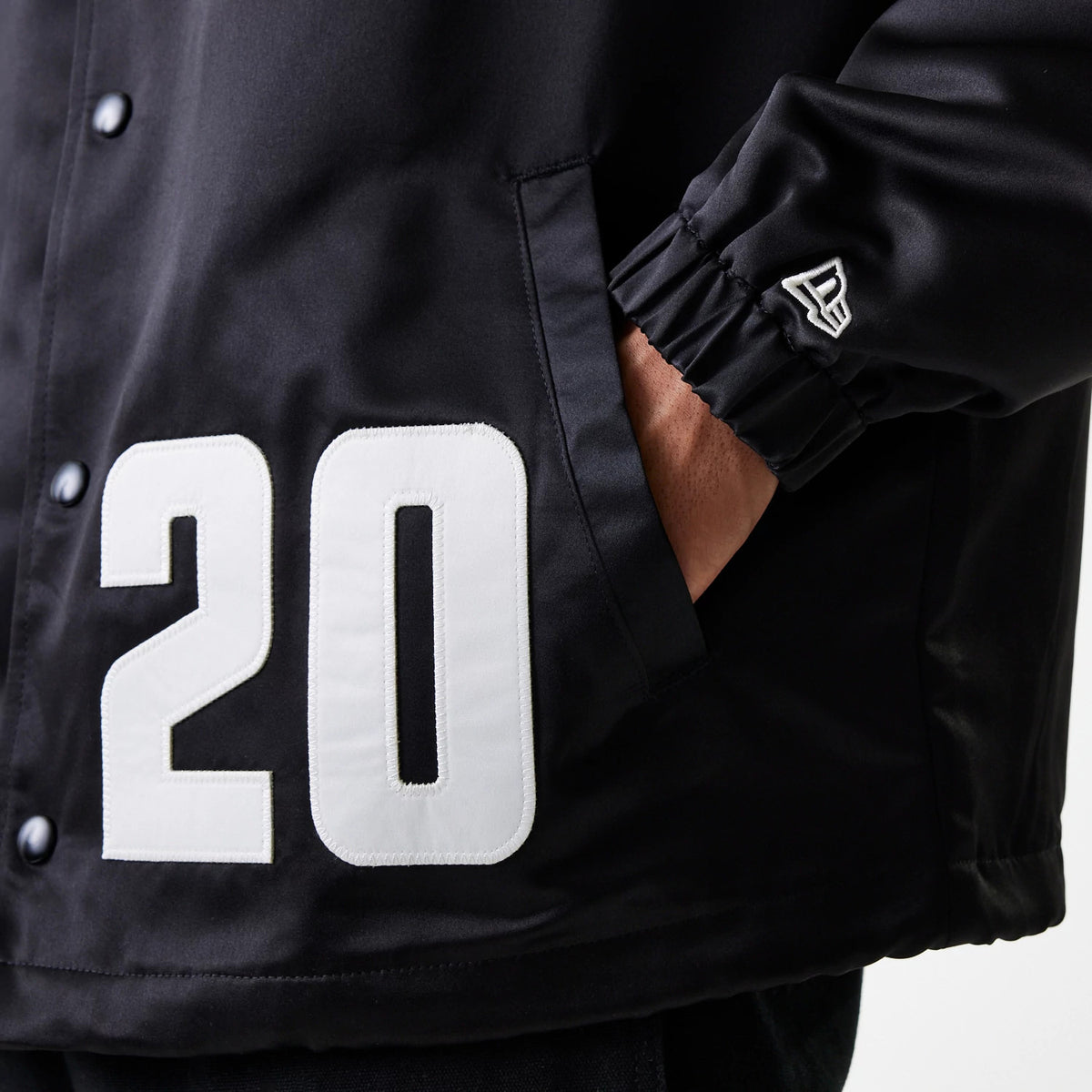 The Male model is wearing New Era Black Coaches Jacket 7