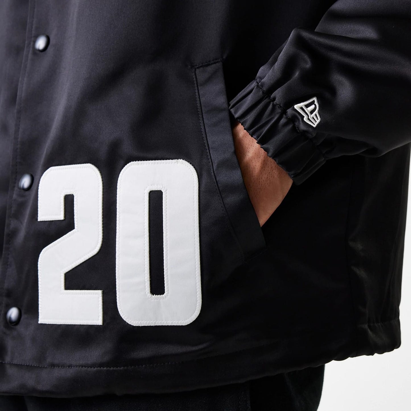 The Male model is wearing New Era Black Coaches Jacket 7
