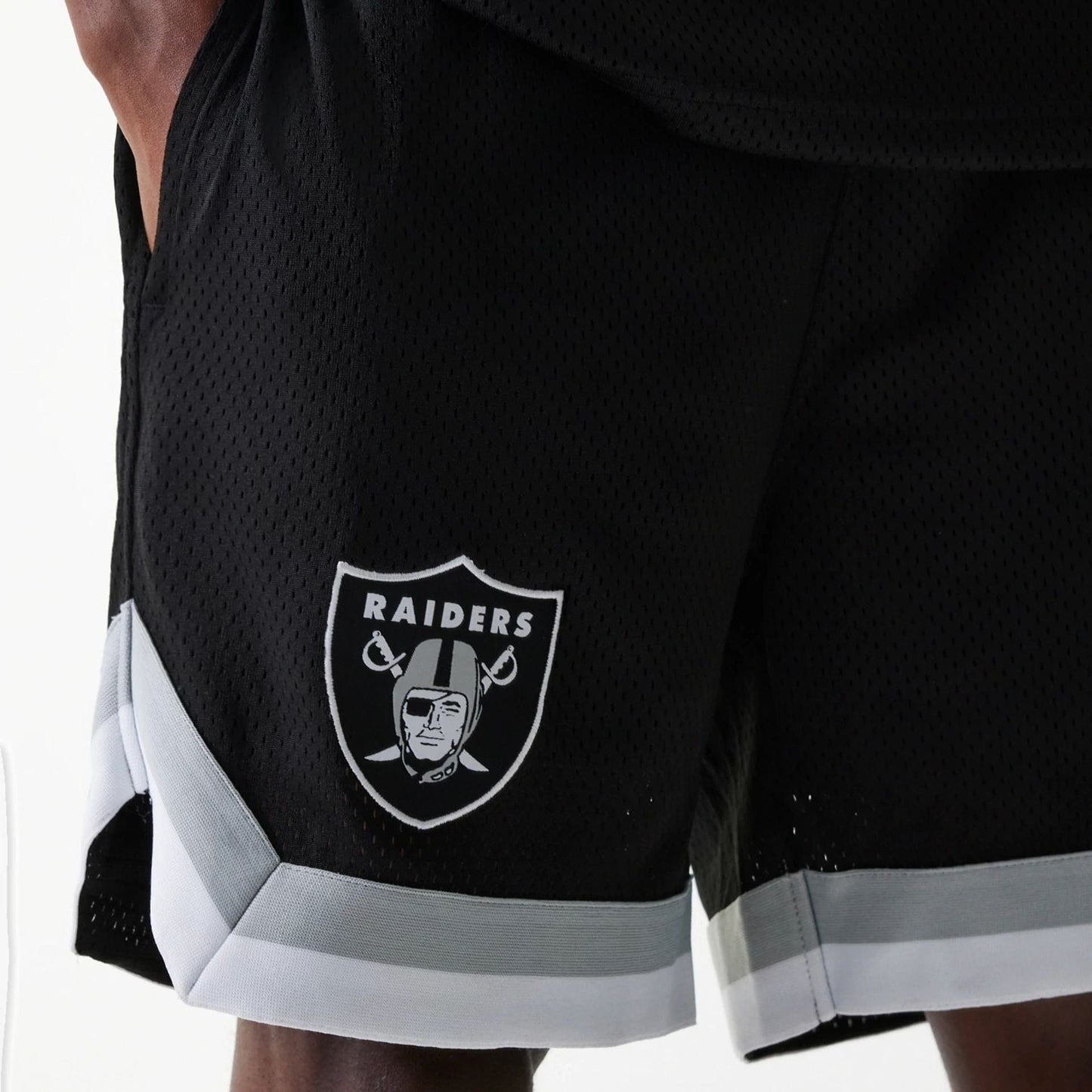 The Male model is wearing Las Vegas Raiders NFL Mesh Black Shorts 3