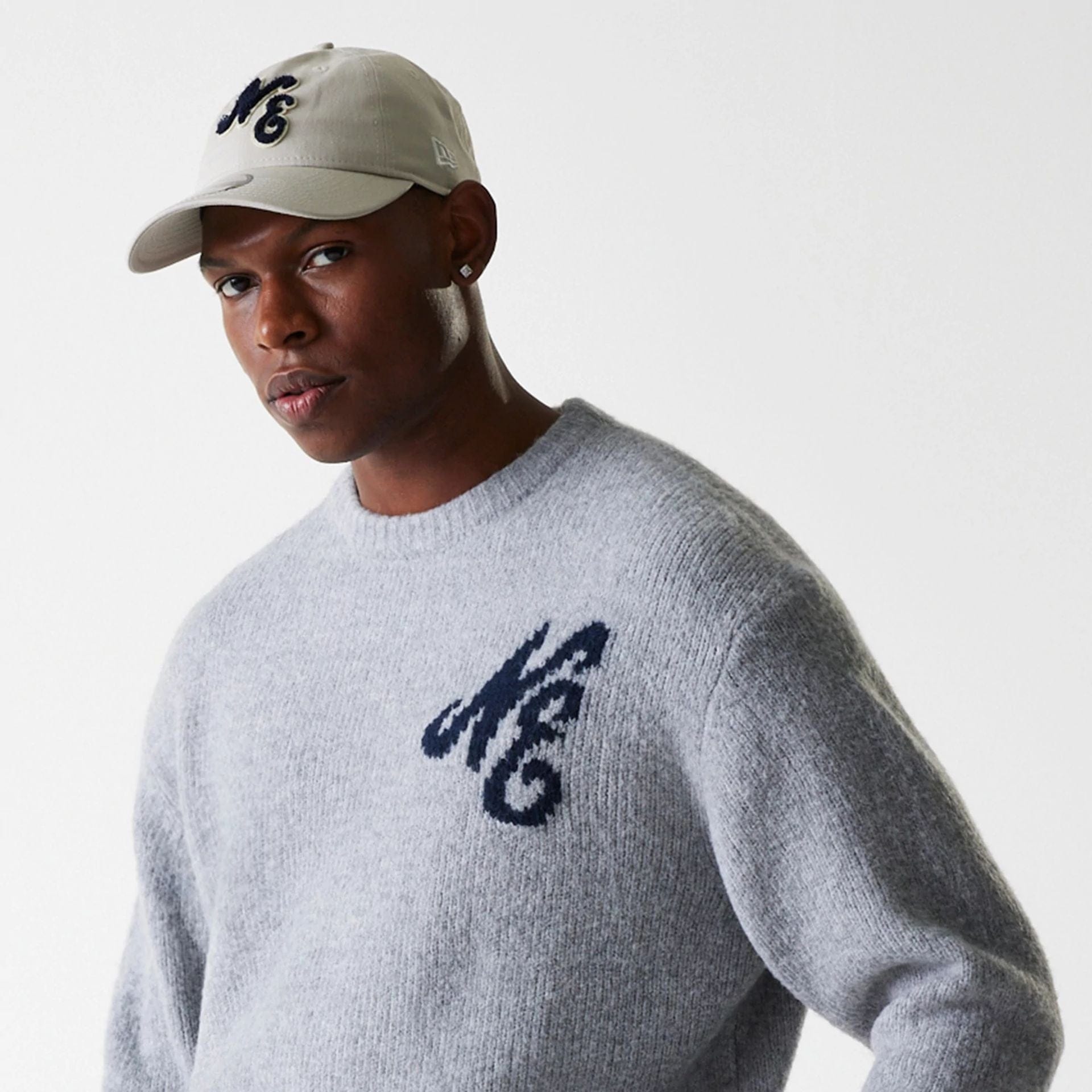 The Male model is wearing New Era Knit Grey Oversized Knit Sweater 6