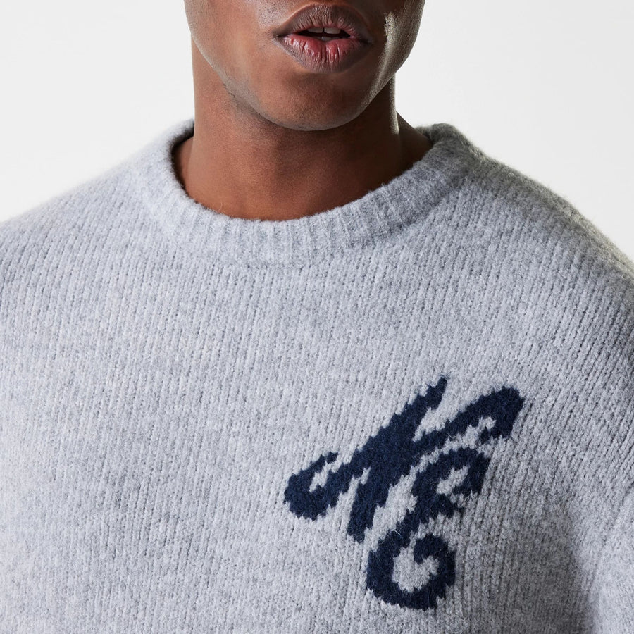 The Male model is wearing New Era Knit Grey Oversized Knit Sweater 5