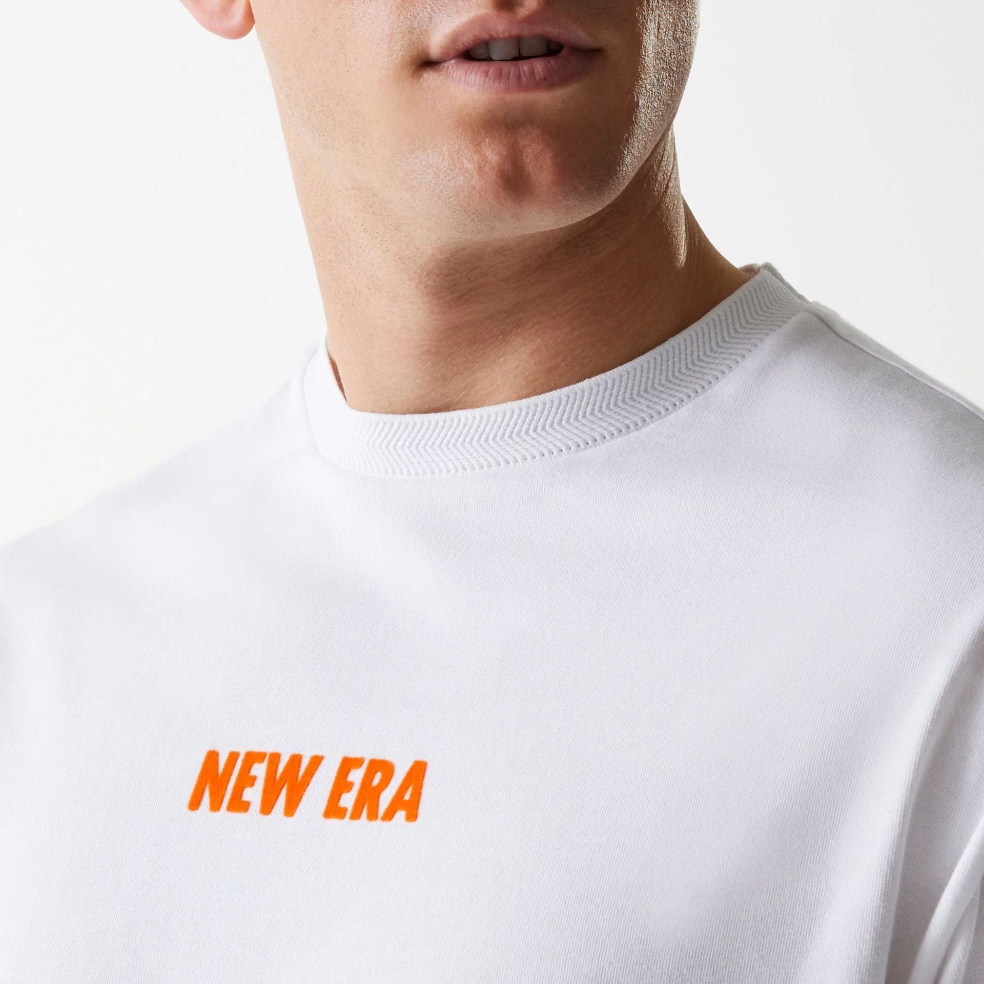 The Male model is wearing New Era Graphic White Oversized T-Shirt 5