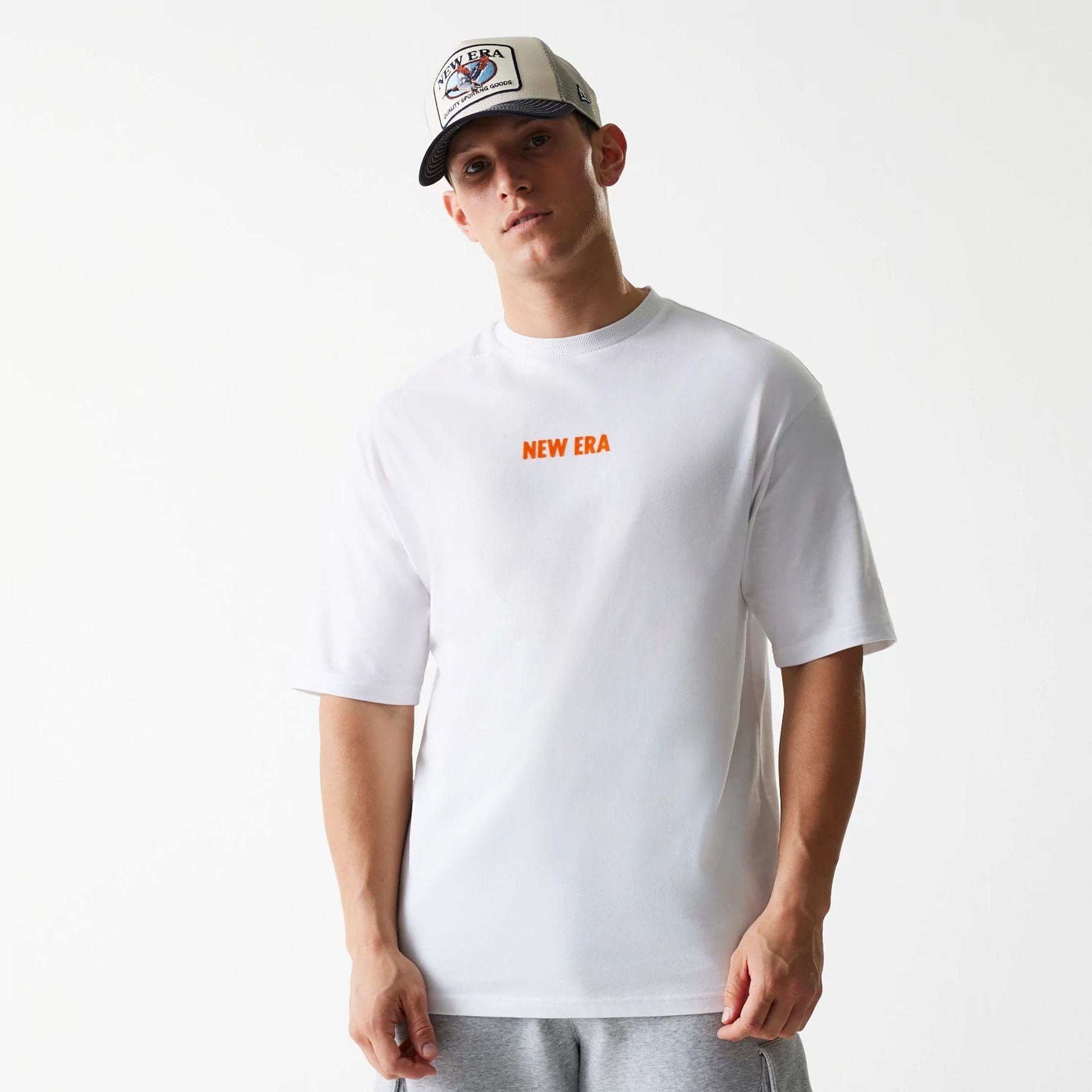 The Male model is wearing New Era Graphic White Oversized T-Shirt 1