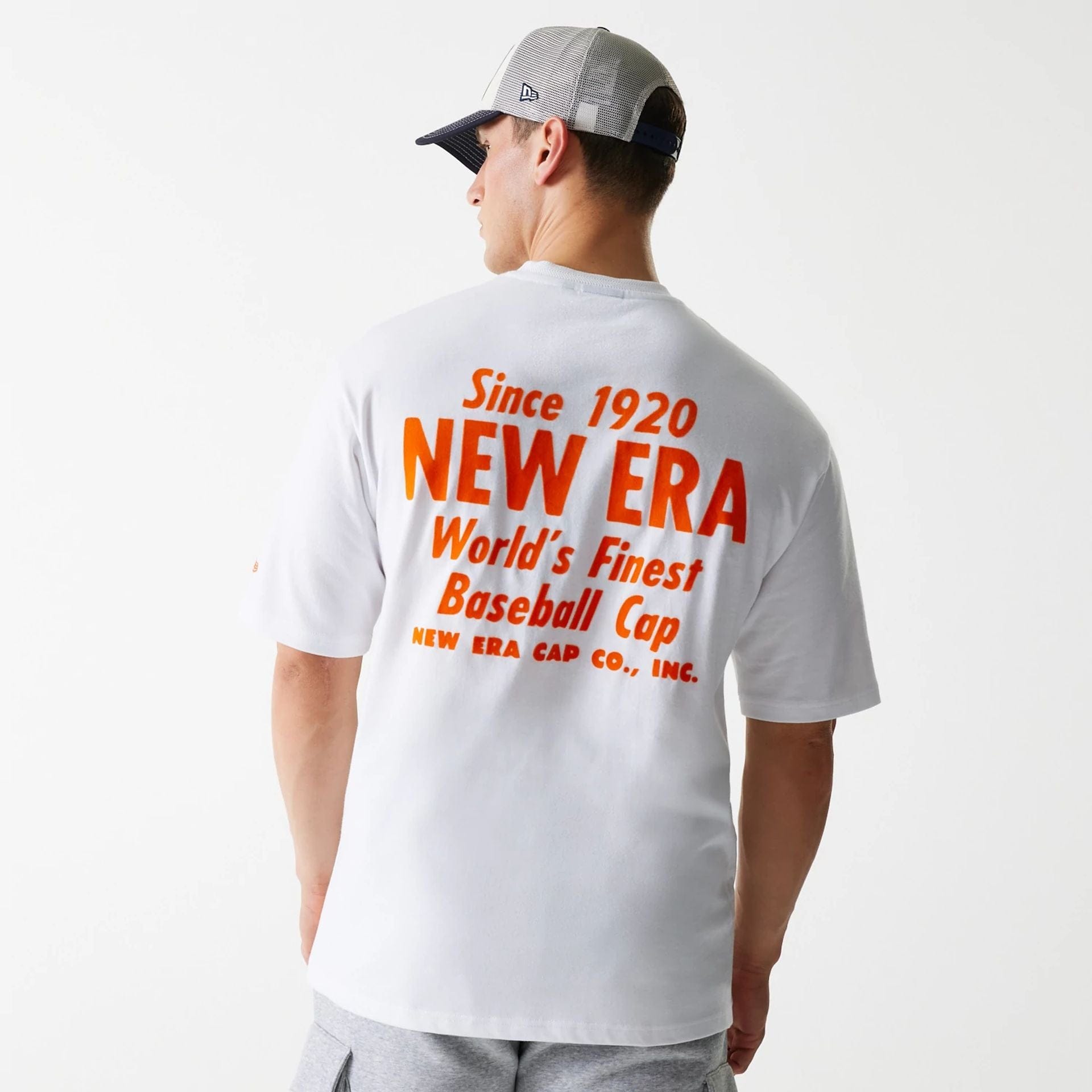 The Male model is wearing New Era Graphic White Oversized T-Shirt 2