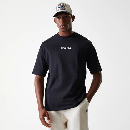 The Male model is wearing New Era Graphic Black Oversized T-Shirt 1