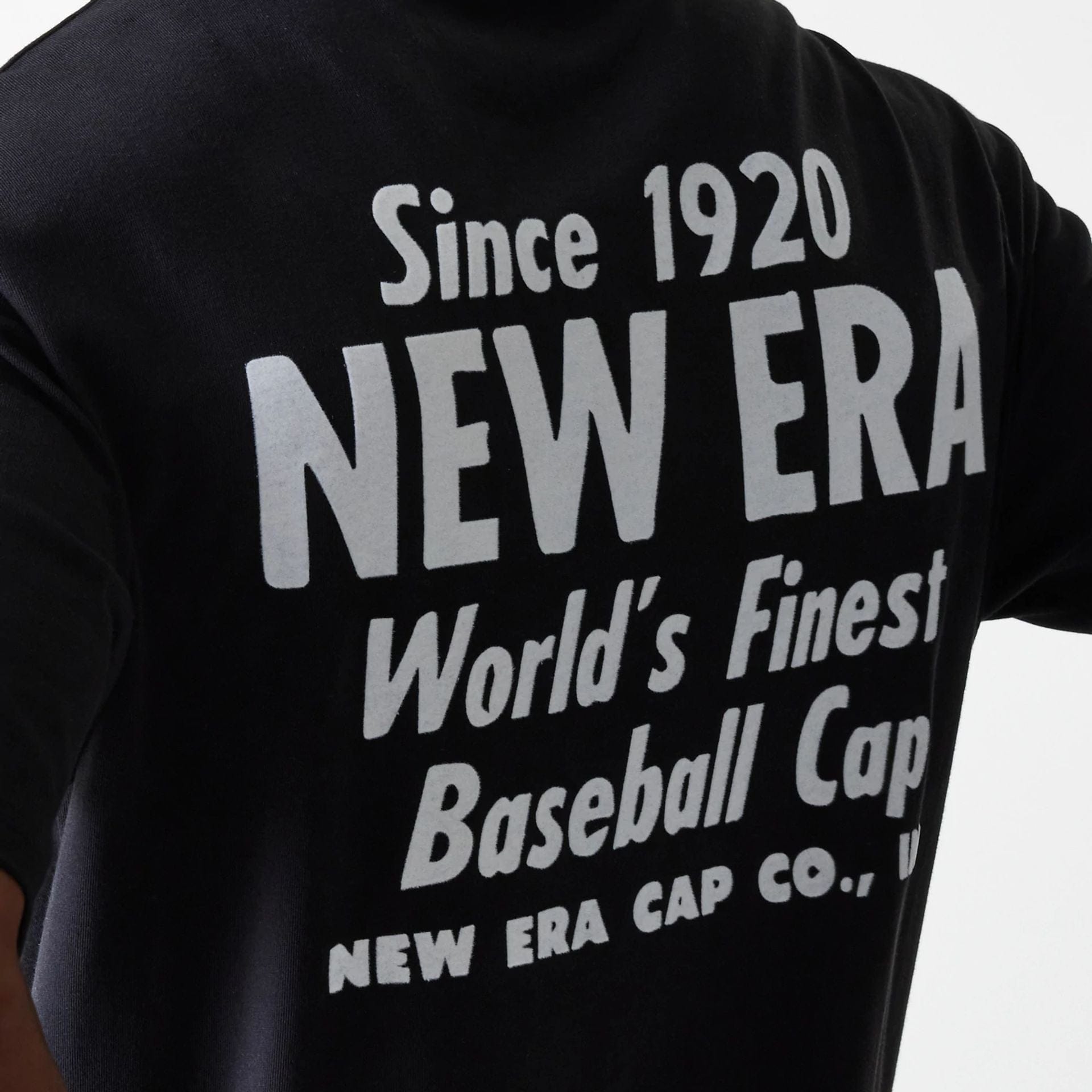 The Male model is wearing New Era Graphic Black Oversized T-Shirt 6