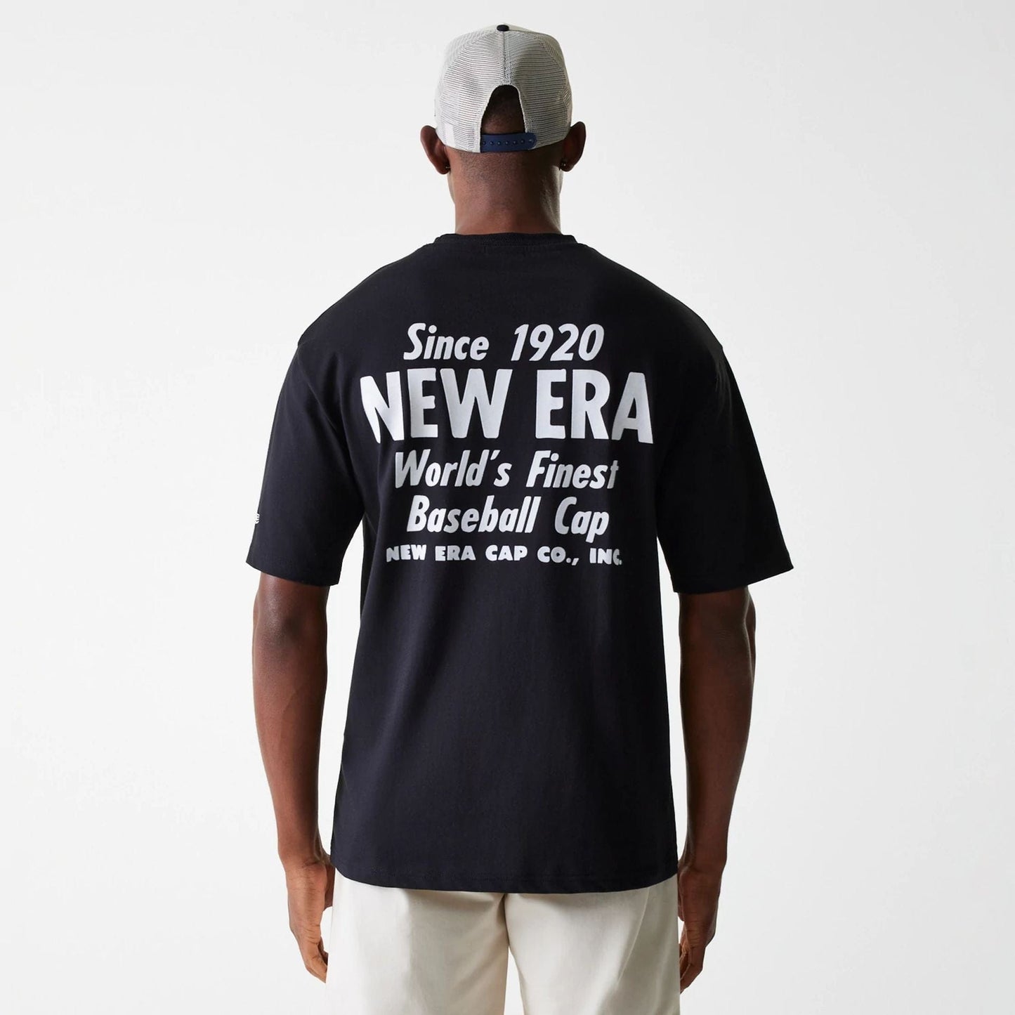 The Male model is wearing New Era Graphic Black Oversized T-Shirt 2