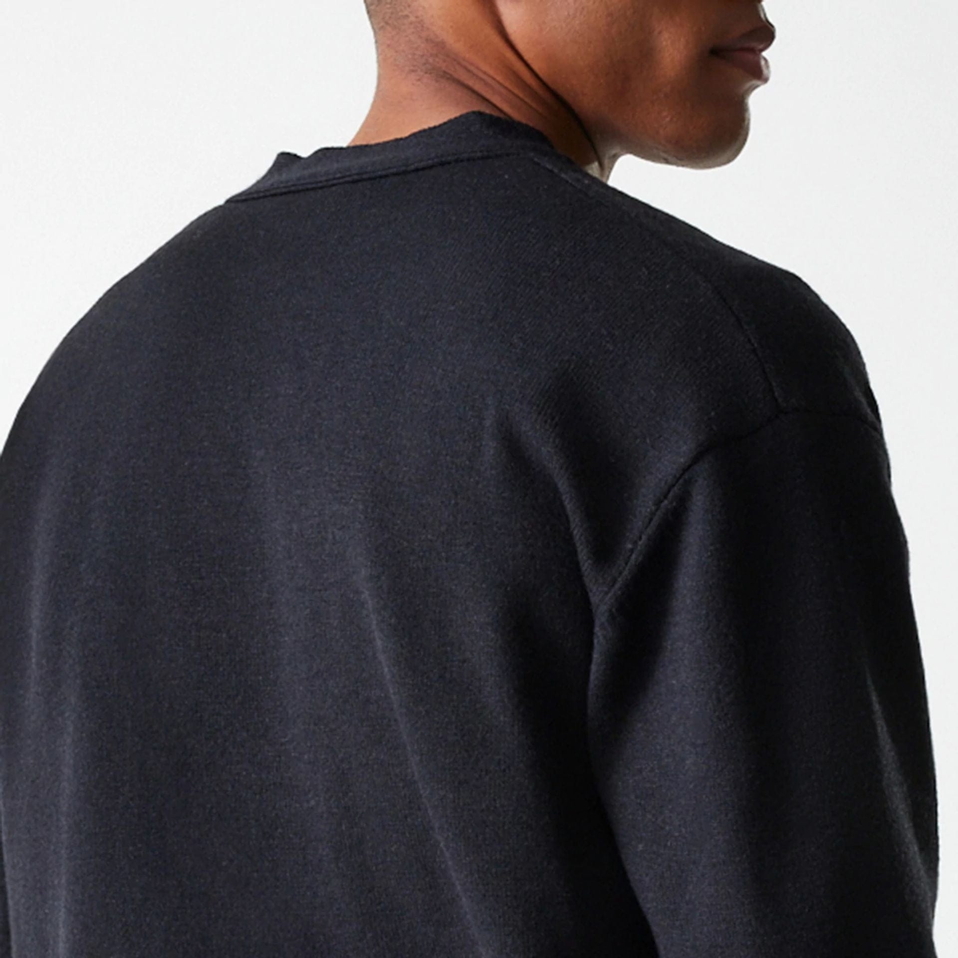 The Male model is wearing New Era Knit Black Cardigan 8