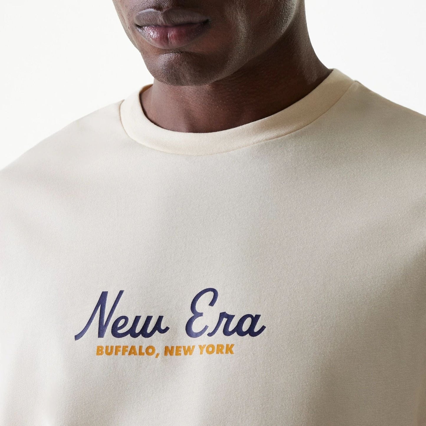 The Male model is wearing New Era Animal Graphic Light Beige Oversized T-Shirt 5