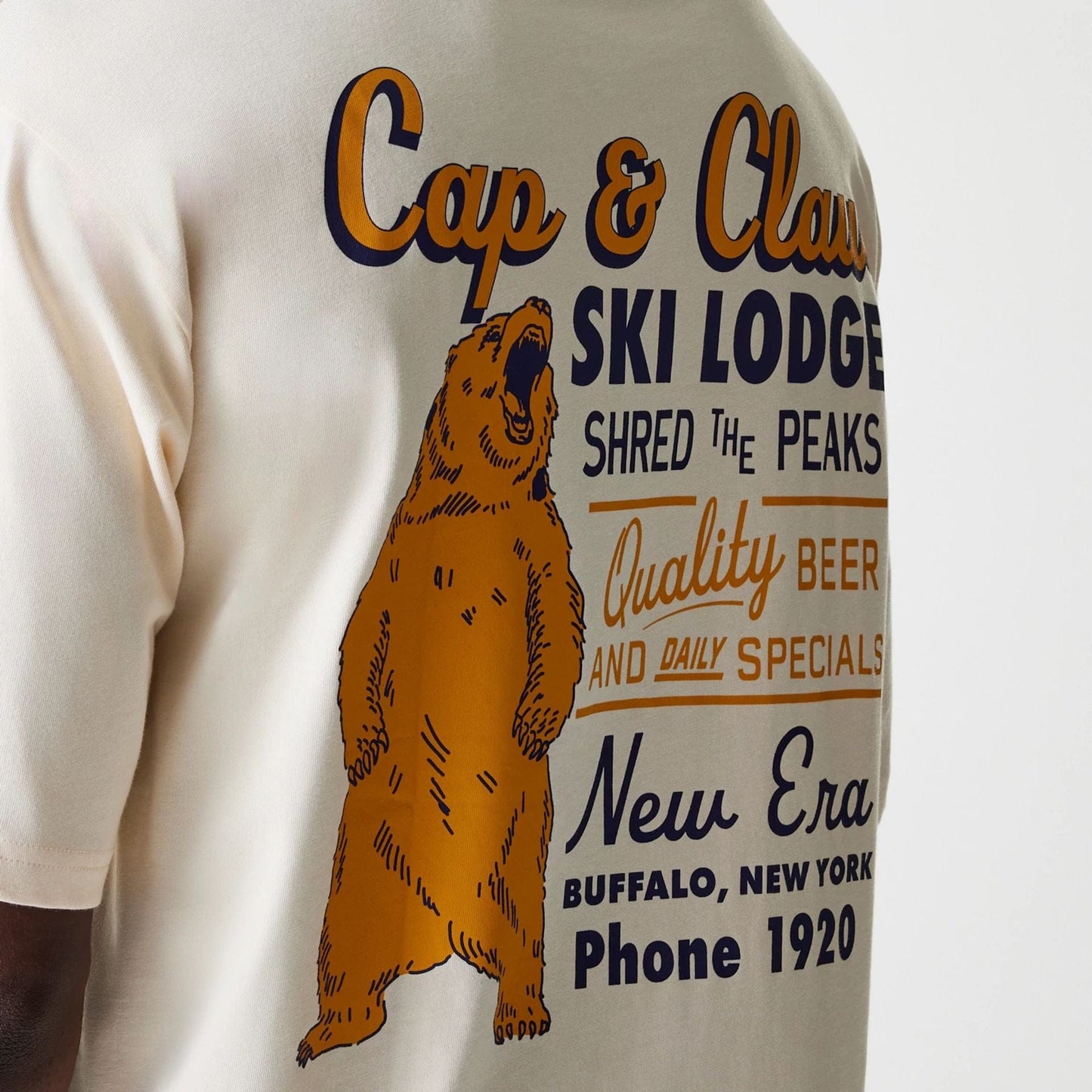 The Male model is wearing New Era Animal Graphic Light Beige Oversized T-Shirt 6