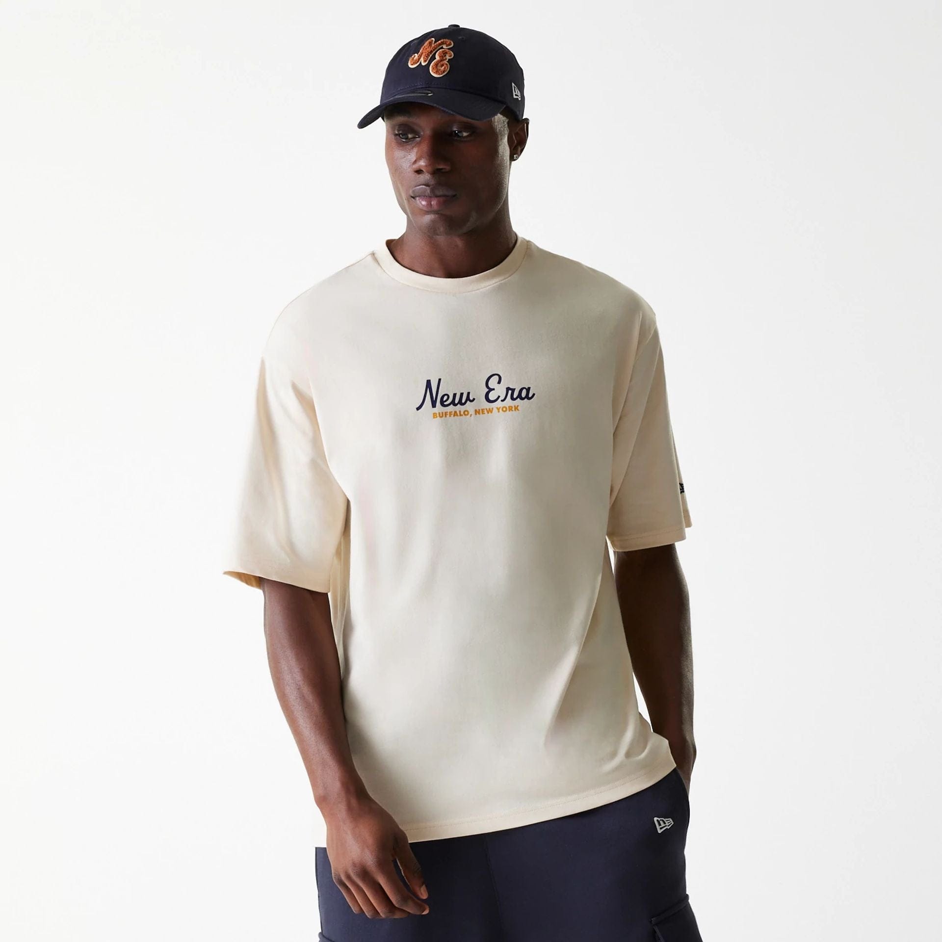 The Male model is wearing New Era Animal Graphic Light Beige Oversized T-Shirt 1