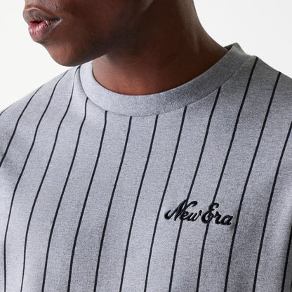 The Male model is wearing New Era Pinstripe Pastel Grey Oversized T-Shirt 4