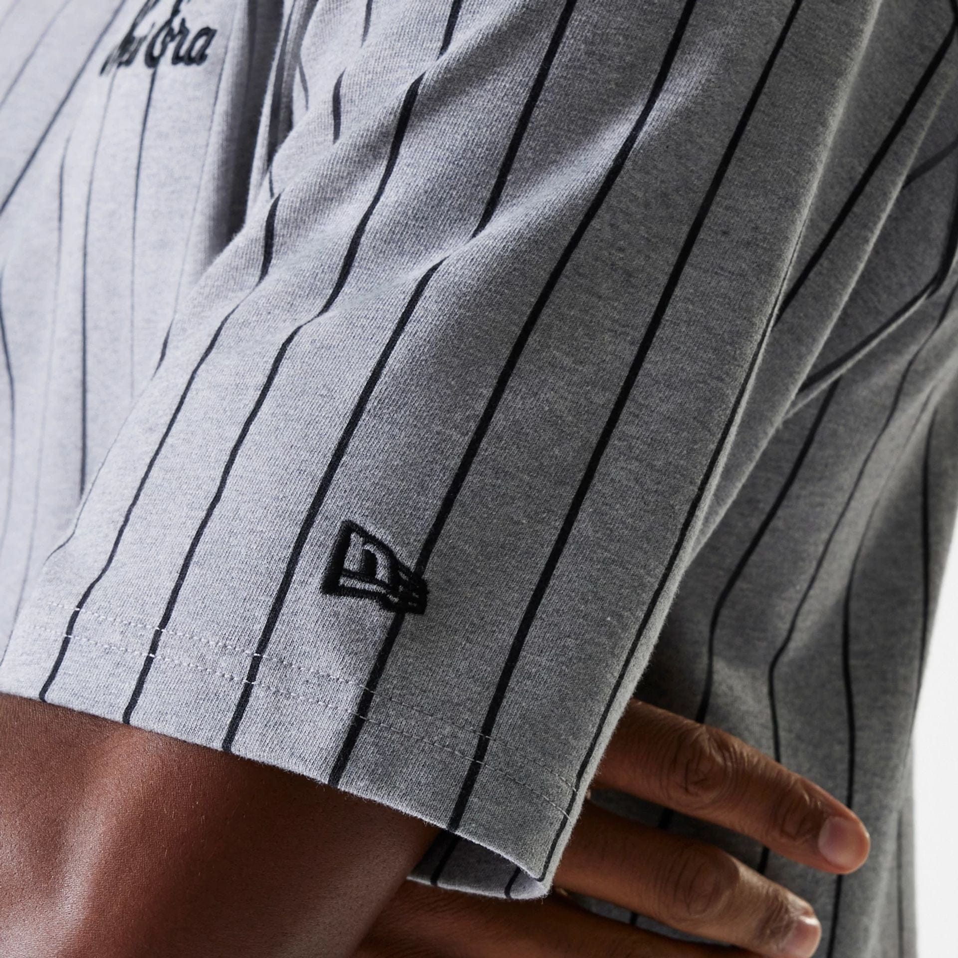 The Male model is wearing New Era Pinstripe Pastel Grey Oversized T-Shirt 7