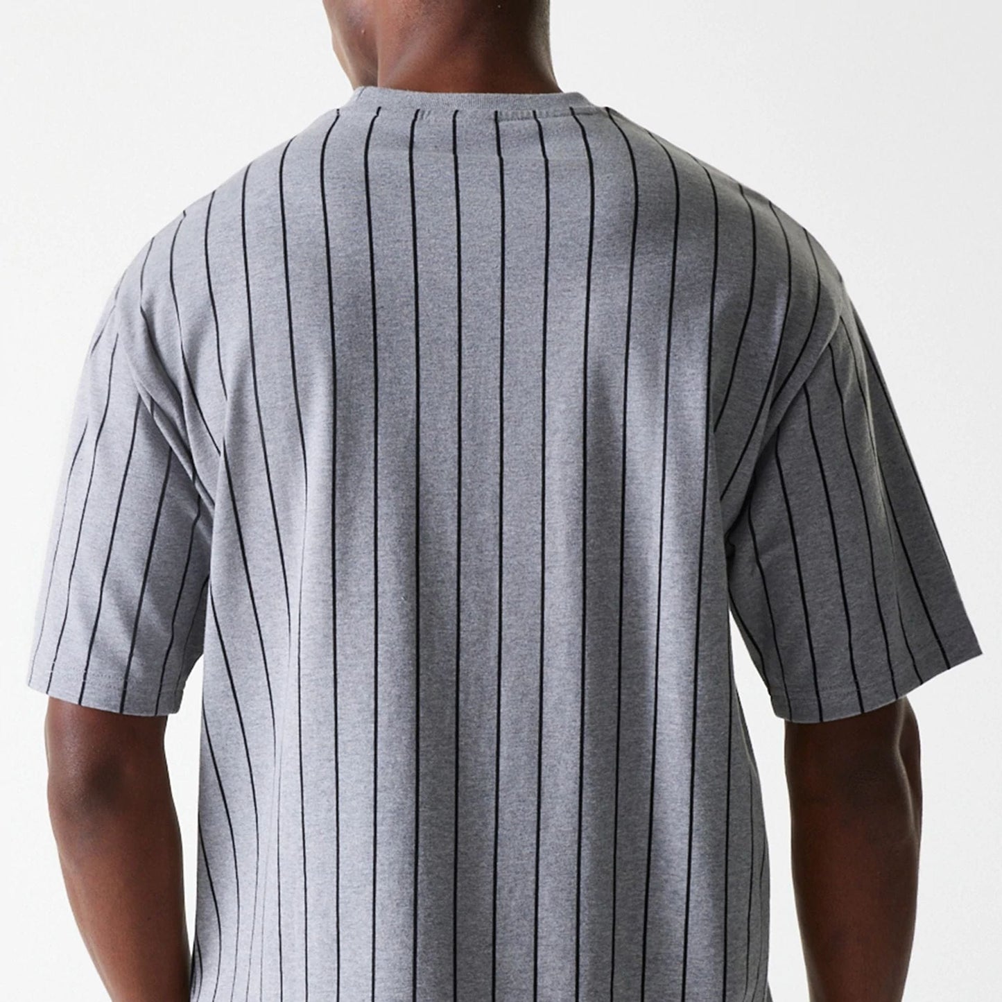 The Male model is wearing New Era Pinstripe Pastel Grey Oversized T-Shirt 6
