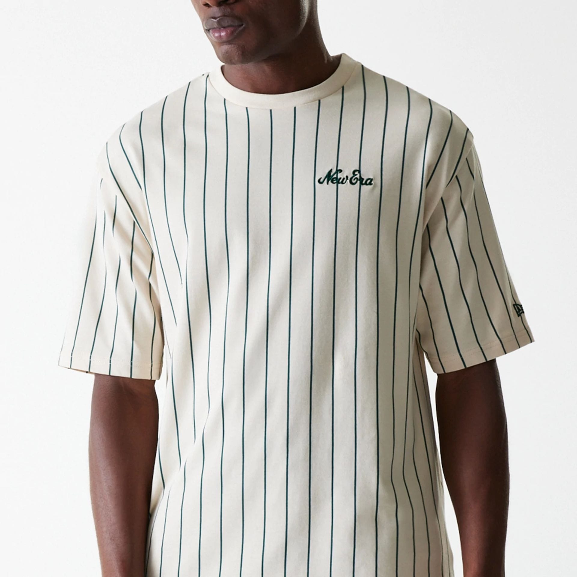 The Male model is wearing New Era Pinstripe Light Beige Oversized T-Shirt 3