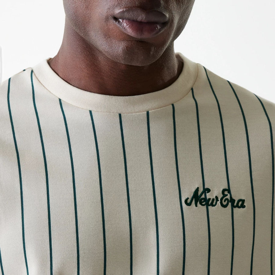 The Male model is wearing New Era Pinstripe Light Beige Oversized T-Shirt 4