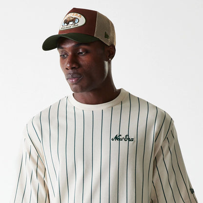 The Male model is wearing New Era Pinstripe Light Beige Oversized T-Shirt 5