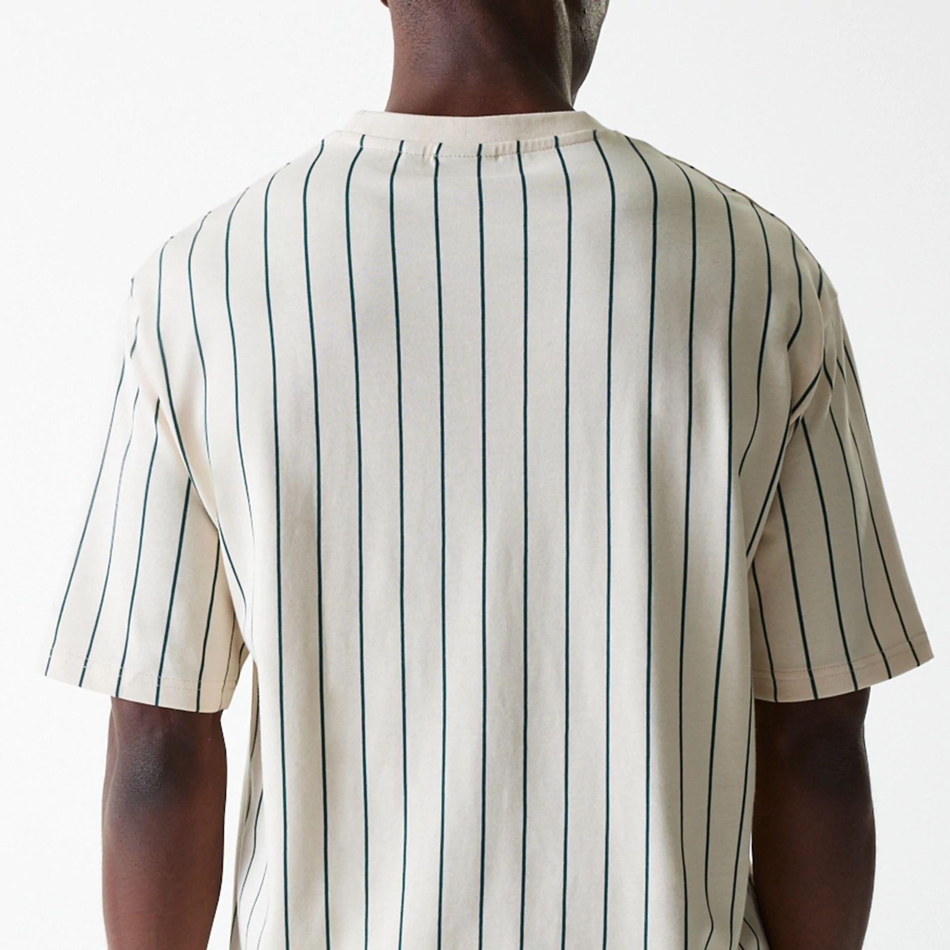 The Male model is wearing New Era Pinstripe Light Beige Oversized T-Shirt 6