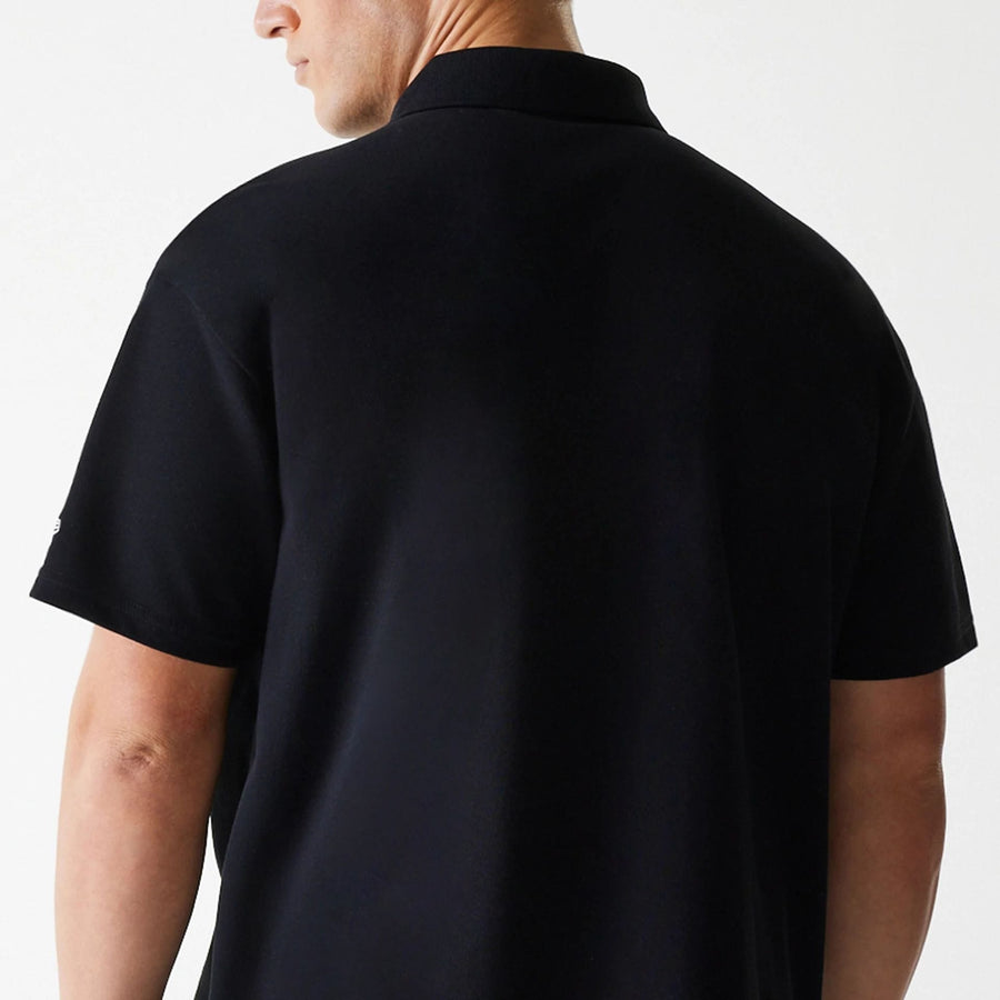 The Male model is wearing New Era Script Black Polo T-Shirt 7