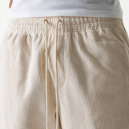 The Male model is wearing New Era Cord Light Beige Shorts 5