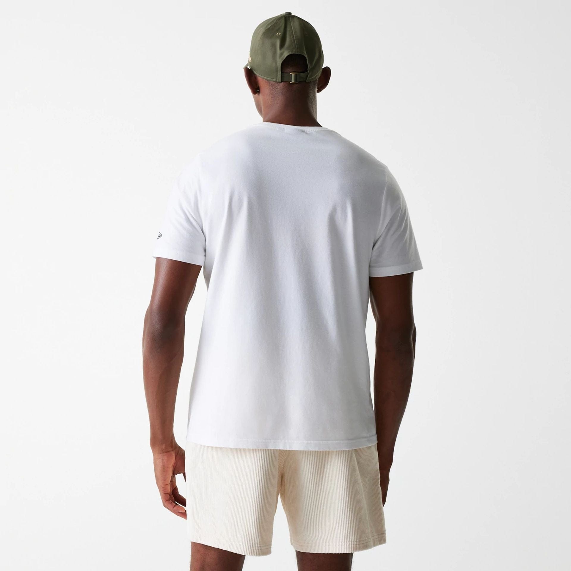 The Male model is wearing New Era Cord Light Beige Shorts 2