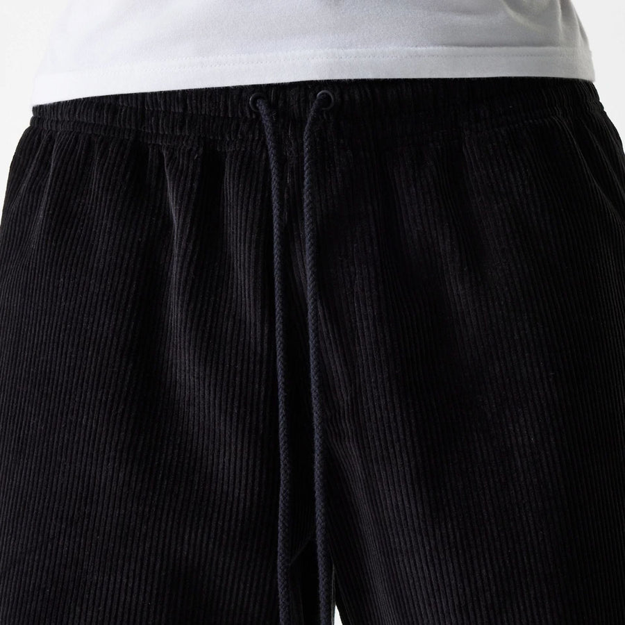 The Male model is wearing New Era Cord Black Shorts 5