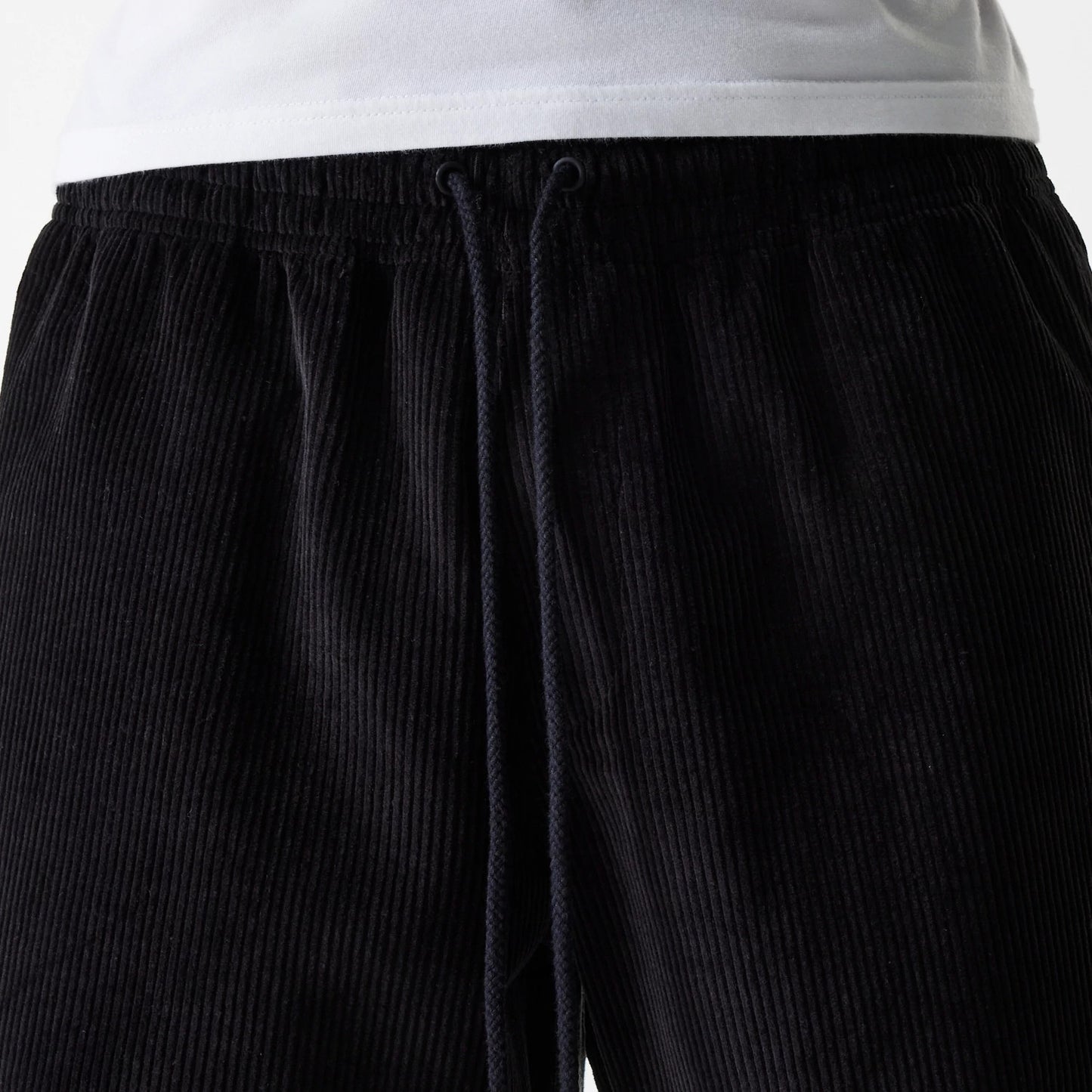 The Male model is wearing New Era Cord Black Shorts 3