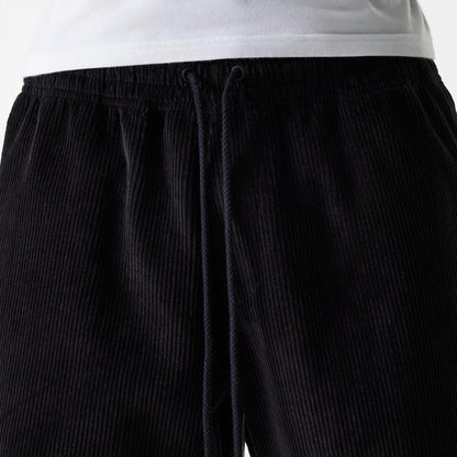 The Male model is wearing New Era Cord Black Shorts 3