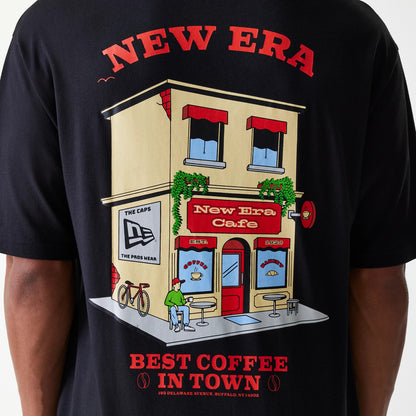 The Male model is wearing New Era Cafe Graphic Black Oversized T-Shirt 8