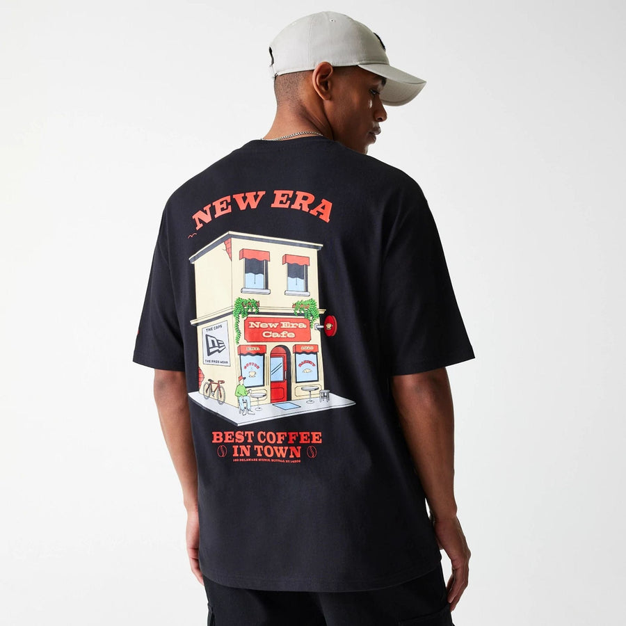 The Male model is wearing New Era Cafe Graphic Black Oversized T-Shirt 4
