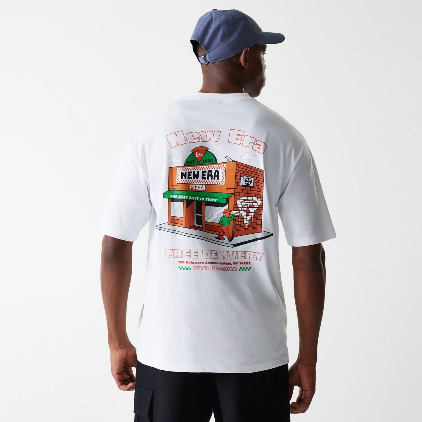 The Male model is wearing New Era Pizza Club Graphic White Oversized T-Shirt 2