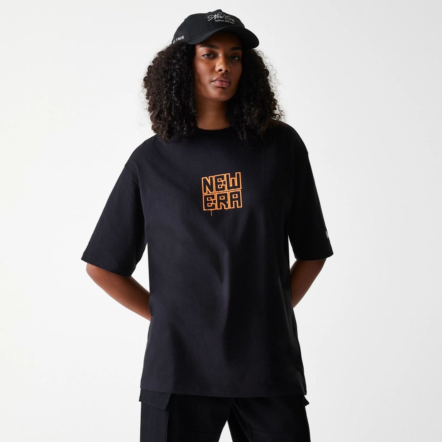 The Male model is wearing New Era Graffiti Graphic Black Oversized T-Shirt 5