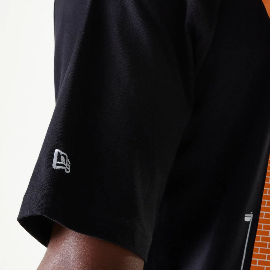 The Male model is wearing New Era Graffiti Graphic Black Oversized T-Shirt 8