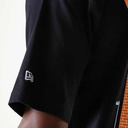 The Male model is wearing New Era Graffiti Graphic Black Oversized T-Shirt 8